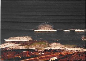 Irregular directional storm waves (including white capping) and regular unidirectional swell.
